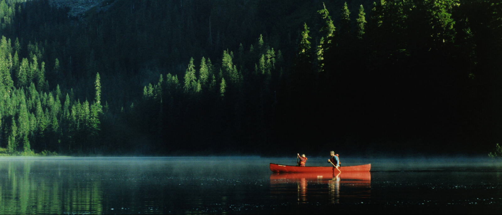 Two people on canoe in water