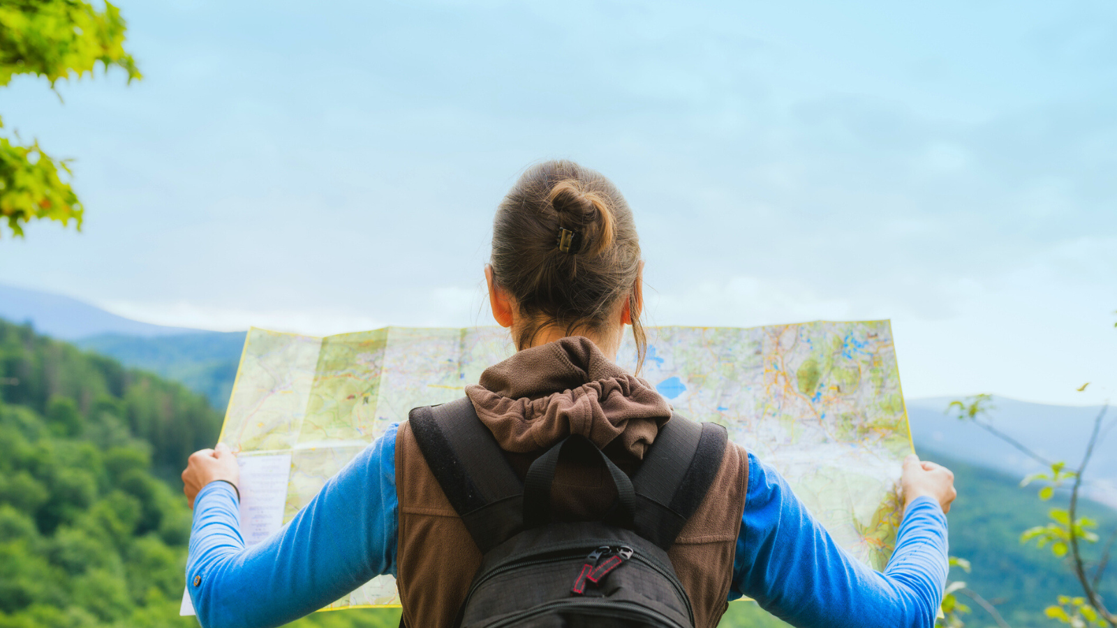 Woman looking at a trail map