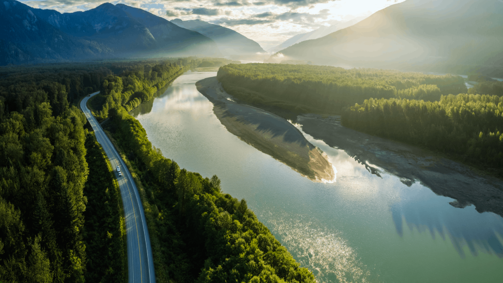 aerial of mountains and windy road