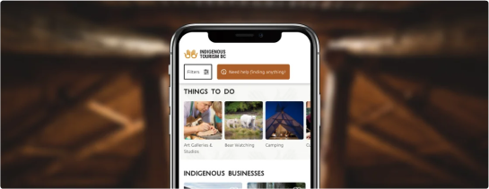 Smartphone displaying a tourism website with categories like 'Art Galleries', 'Bear Watching', and 'Camping'.