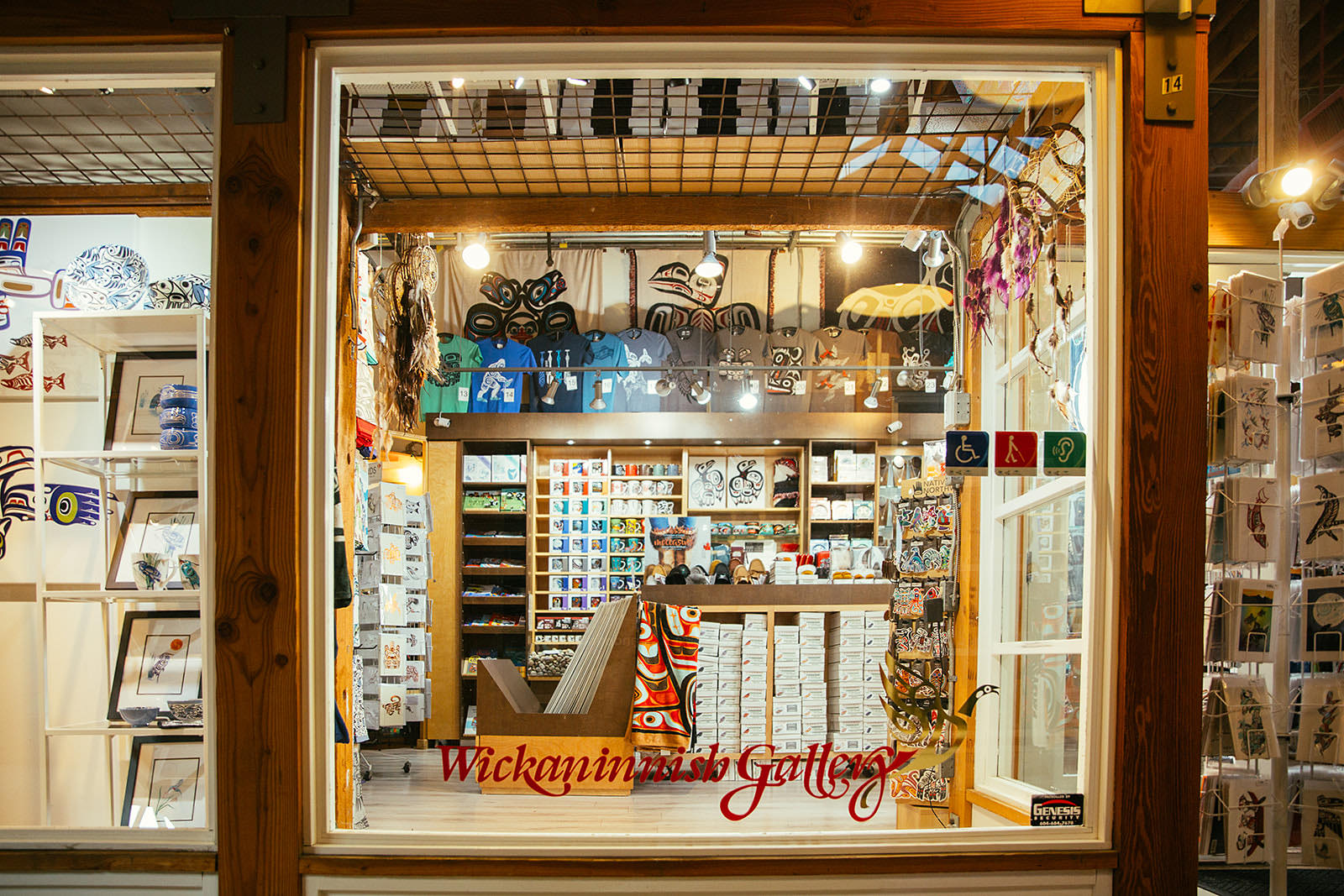 A window of an art gallery displaying Indigenous art