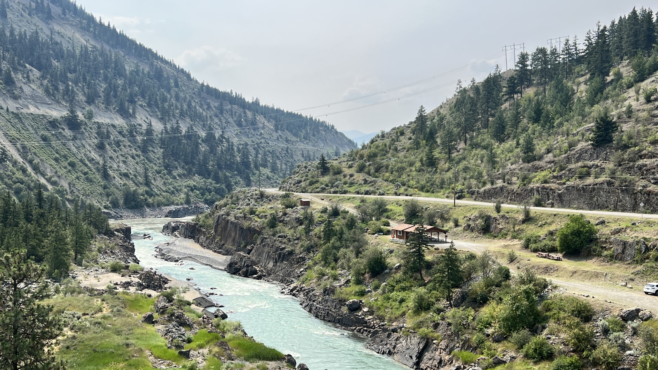 A bright blue river running through the mountains