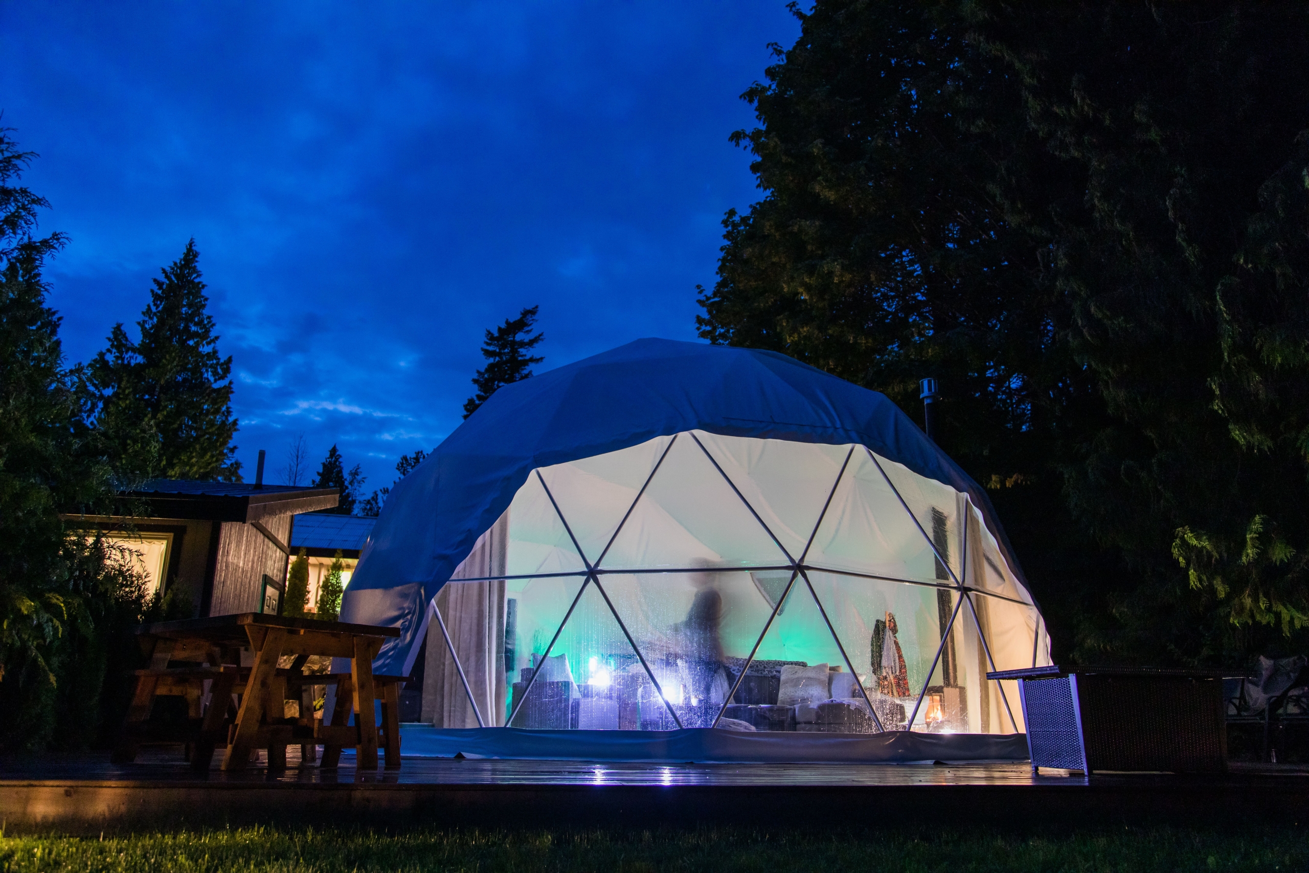 A yurt in the forest at night