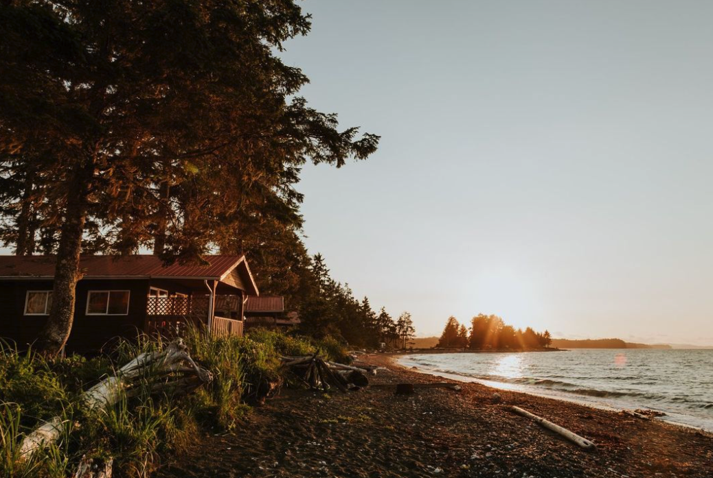 Cabin along the waterfront at sunset