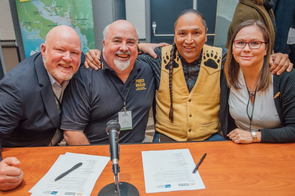 ITBC and Tourism Vancouver Island members smile after signing an MOU