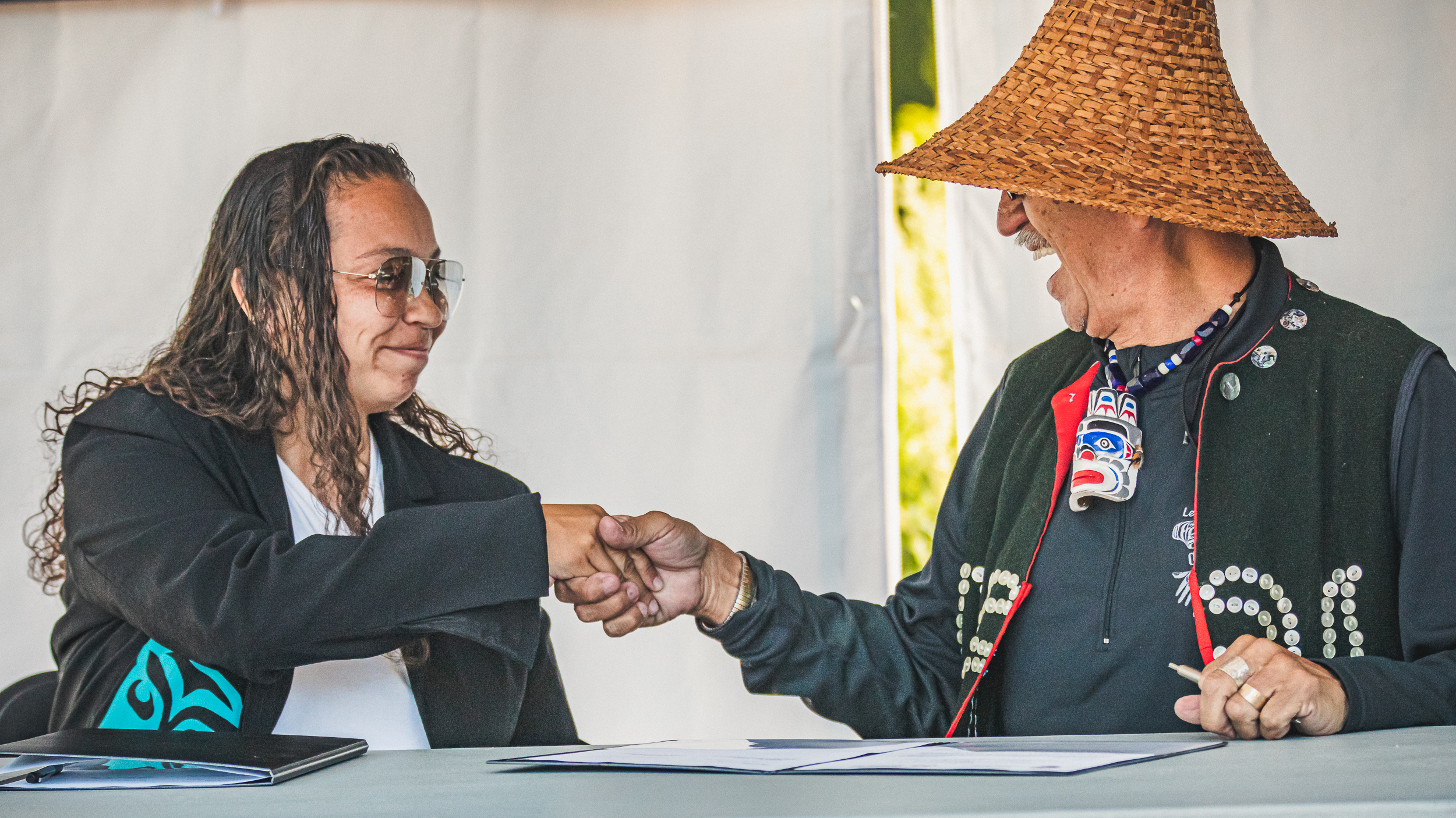 A man and woman shake hands