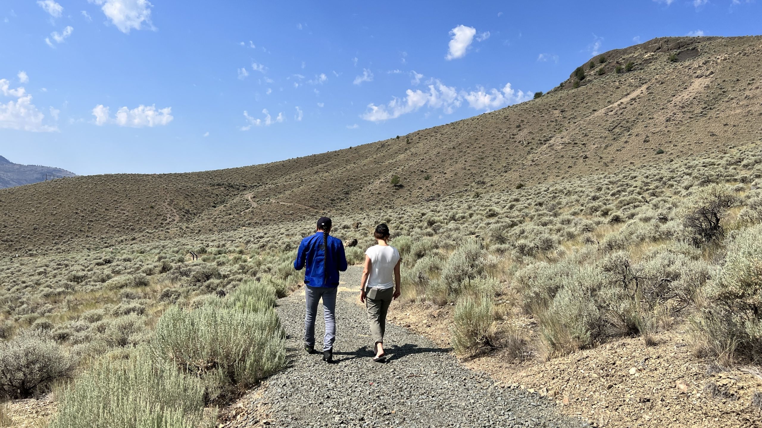 2 people walking down a trail in British Columbia