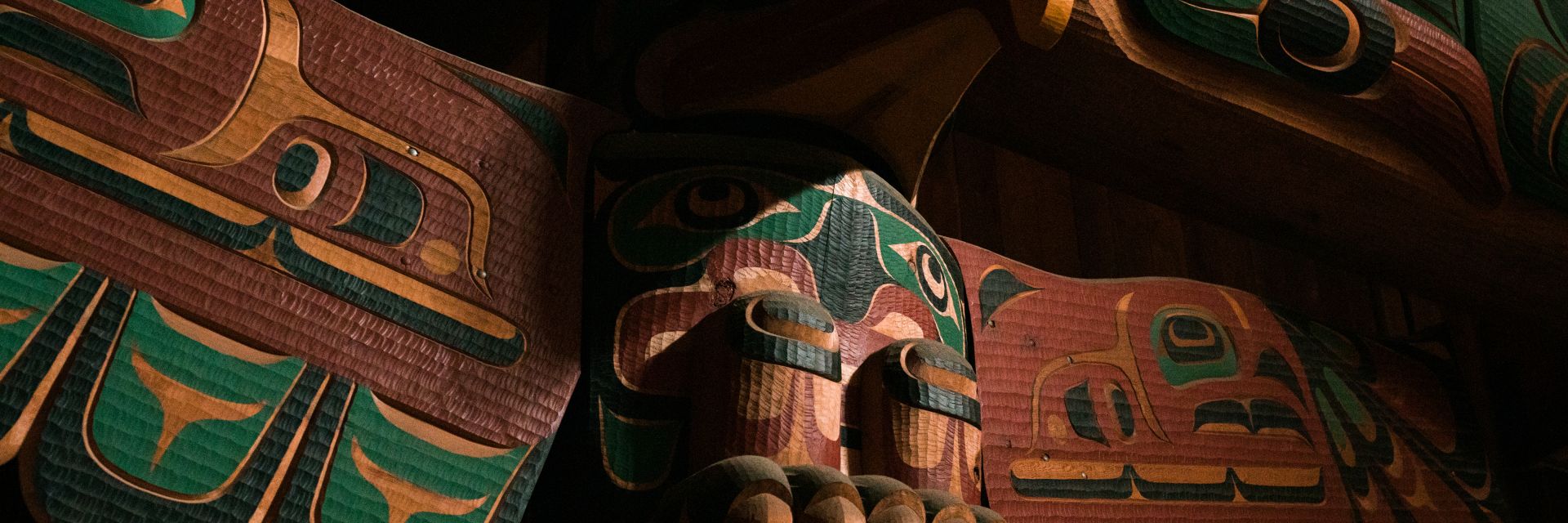 Up close image of a Totem pole.