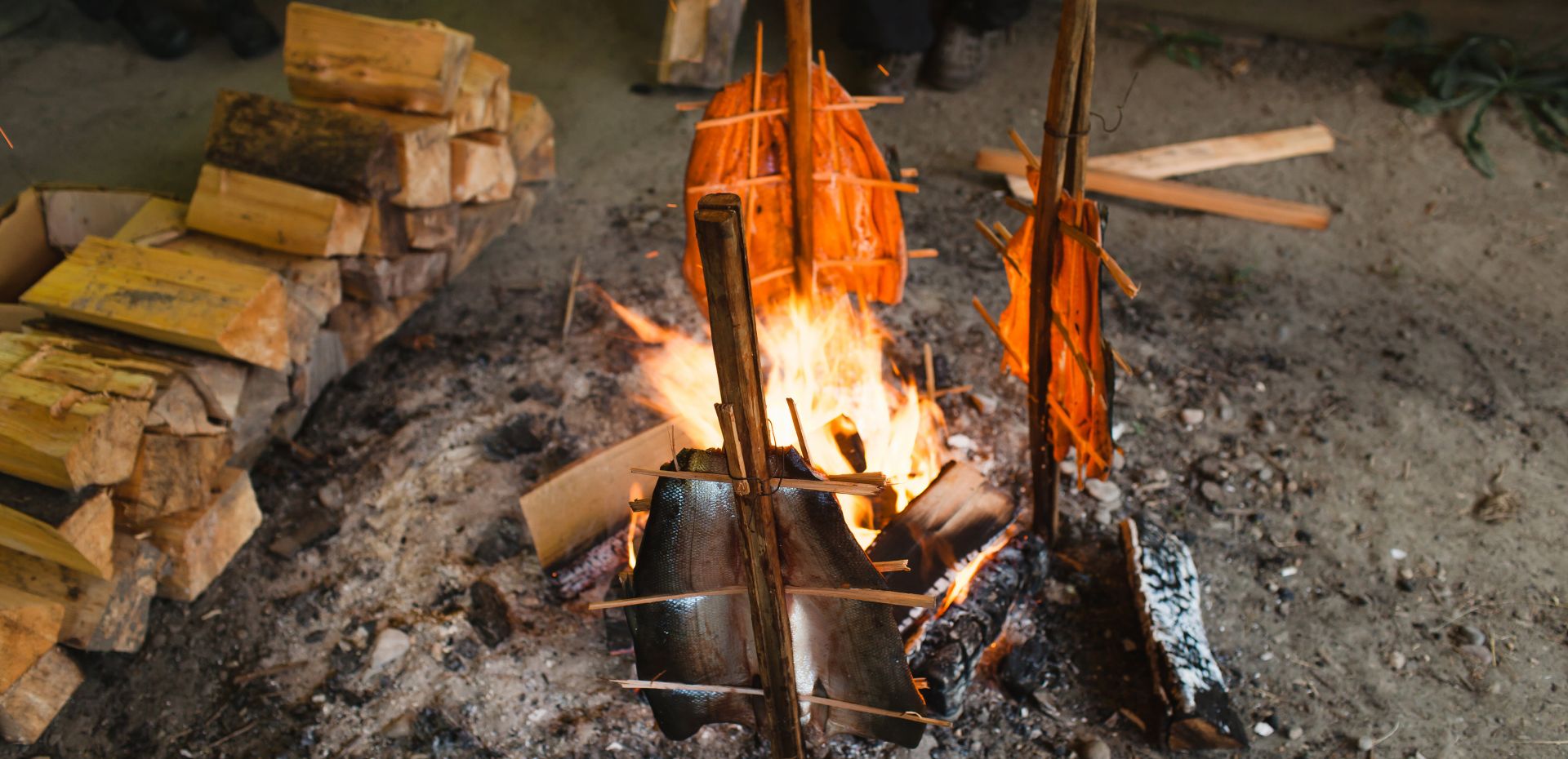 Fish cooking over a fire