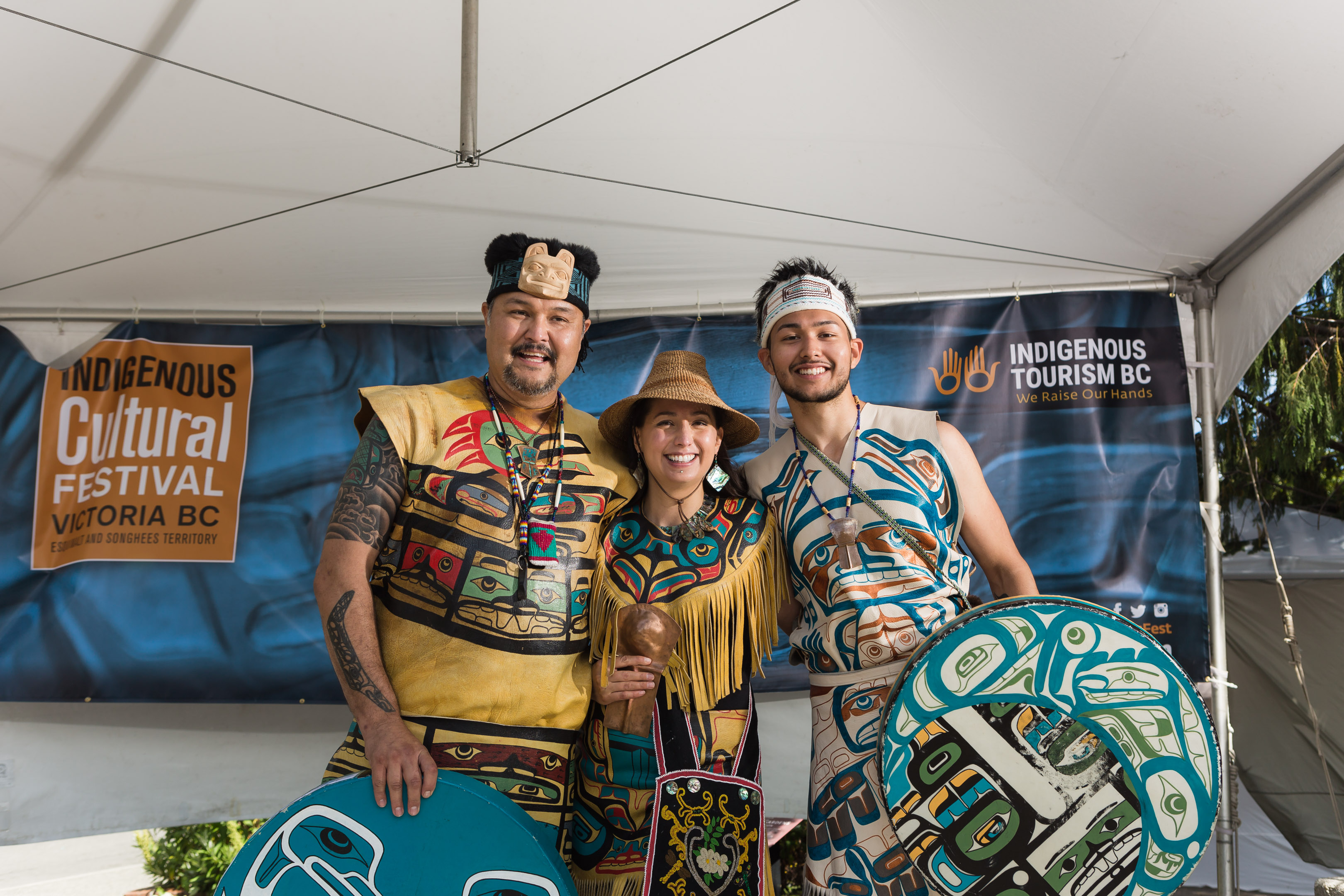 3 people dressed up in traditional clothing fr the cultural festival Victoria BC