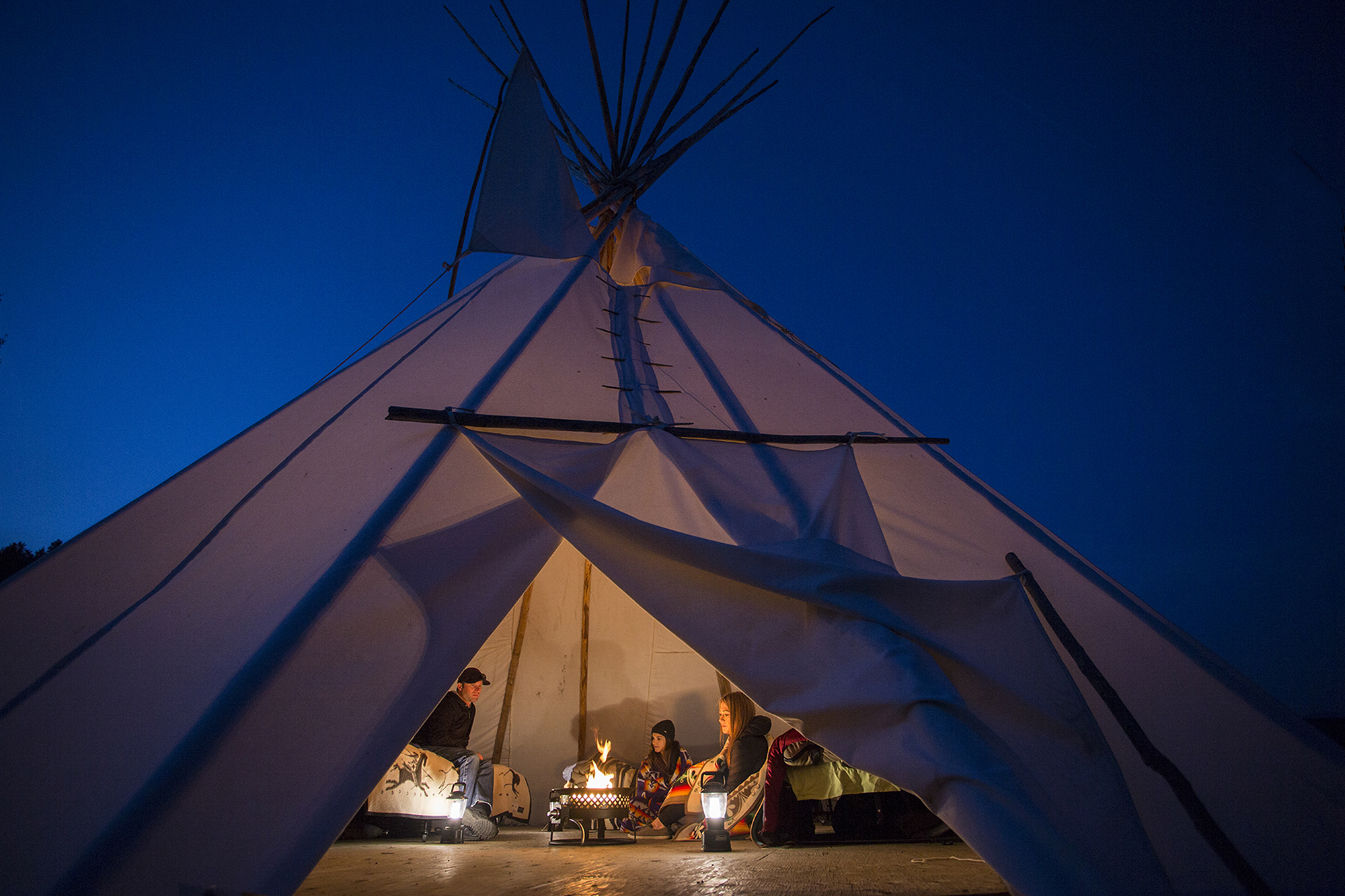 Family camping in a Teepee.