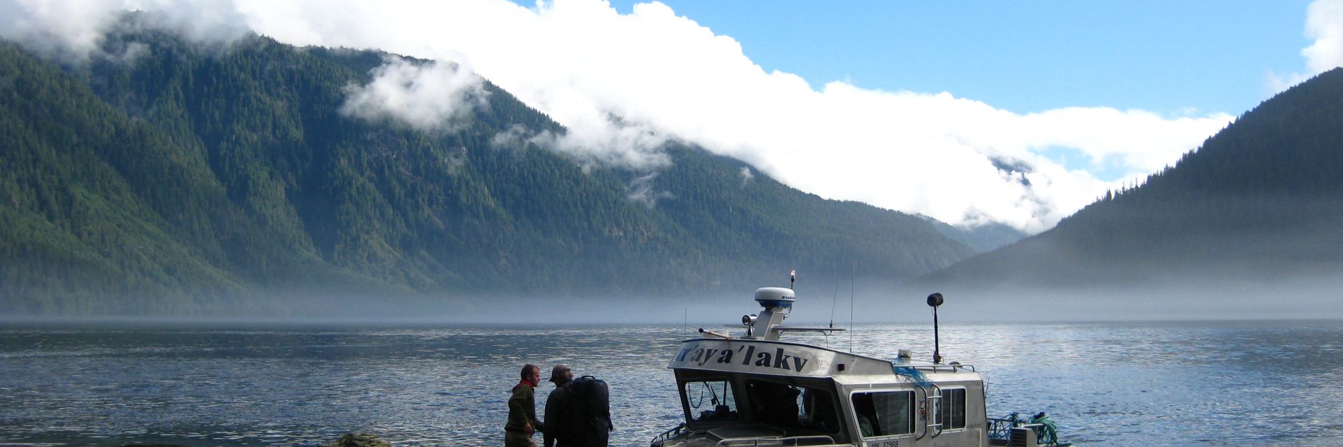 A boat on the water in the mountains