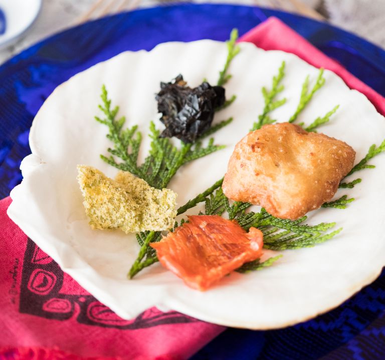 Indigenous food served on a cleaned scallop shell