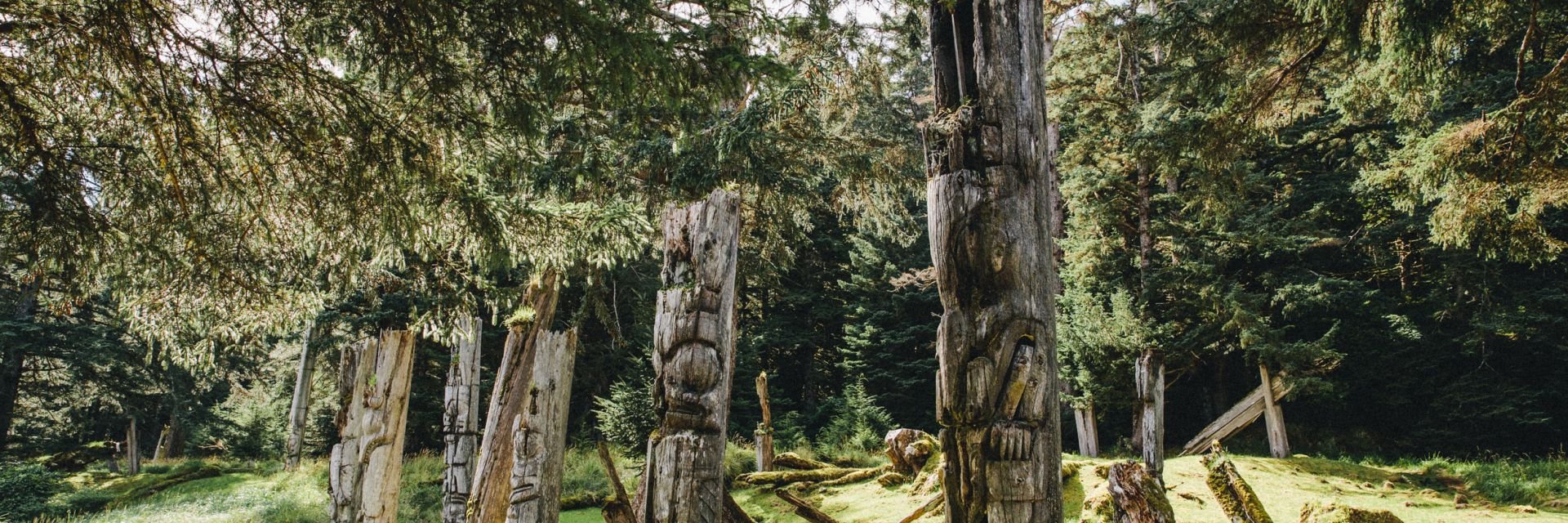 UNESCO site with trees and very old totem poles