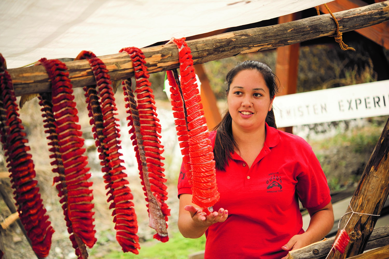 A person drying out some fish