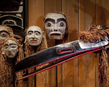 Indigenous masks on a wall.